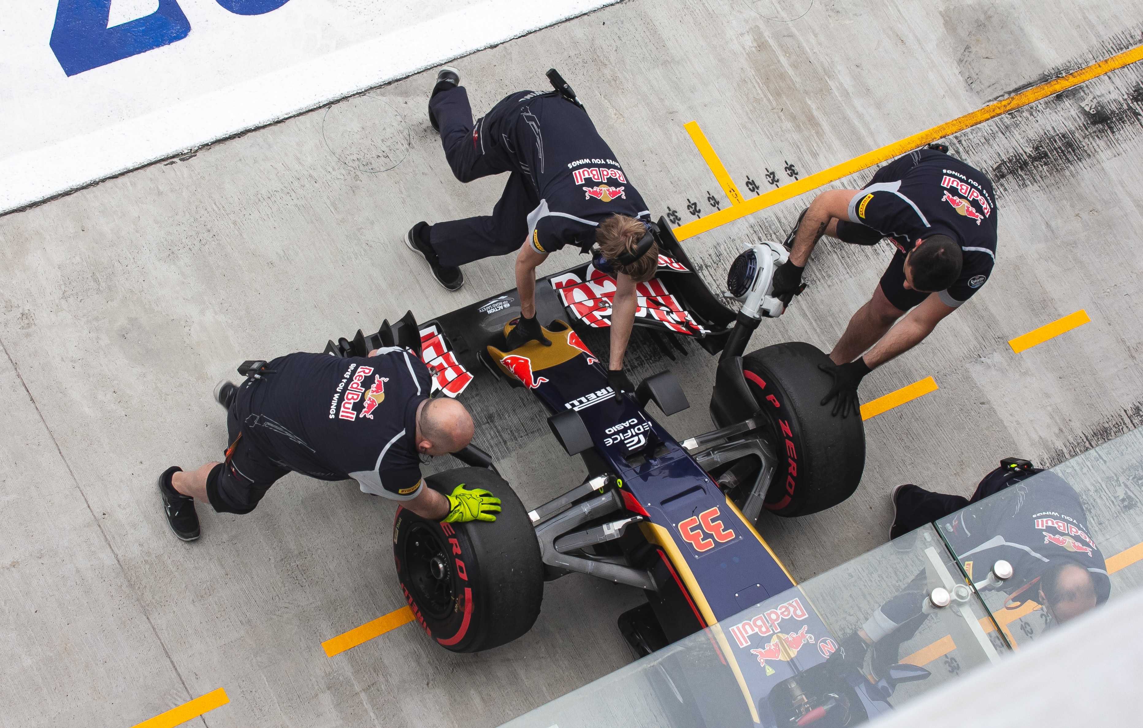 The Red Bull Team putting Verstappen's car in the garage